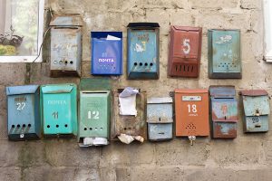 Old mailboxes on a wall.